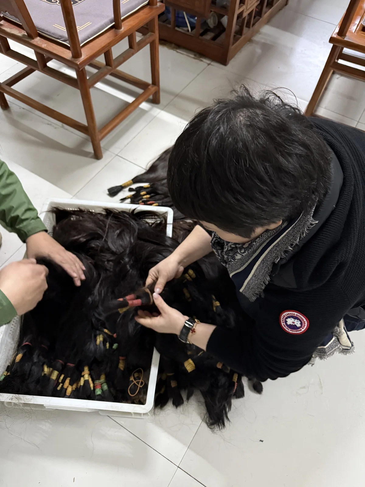 Examining hair bundles before production.