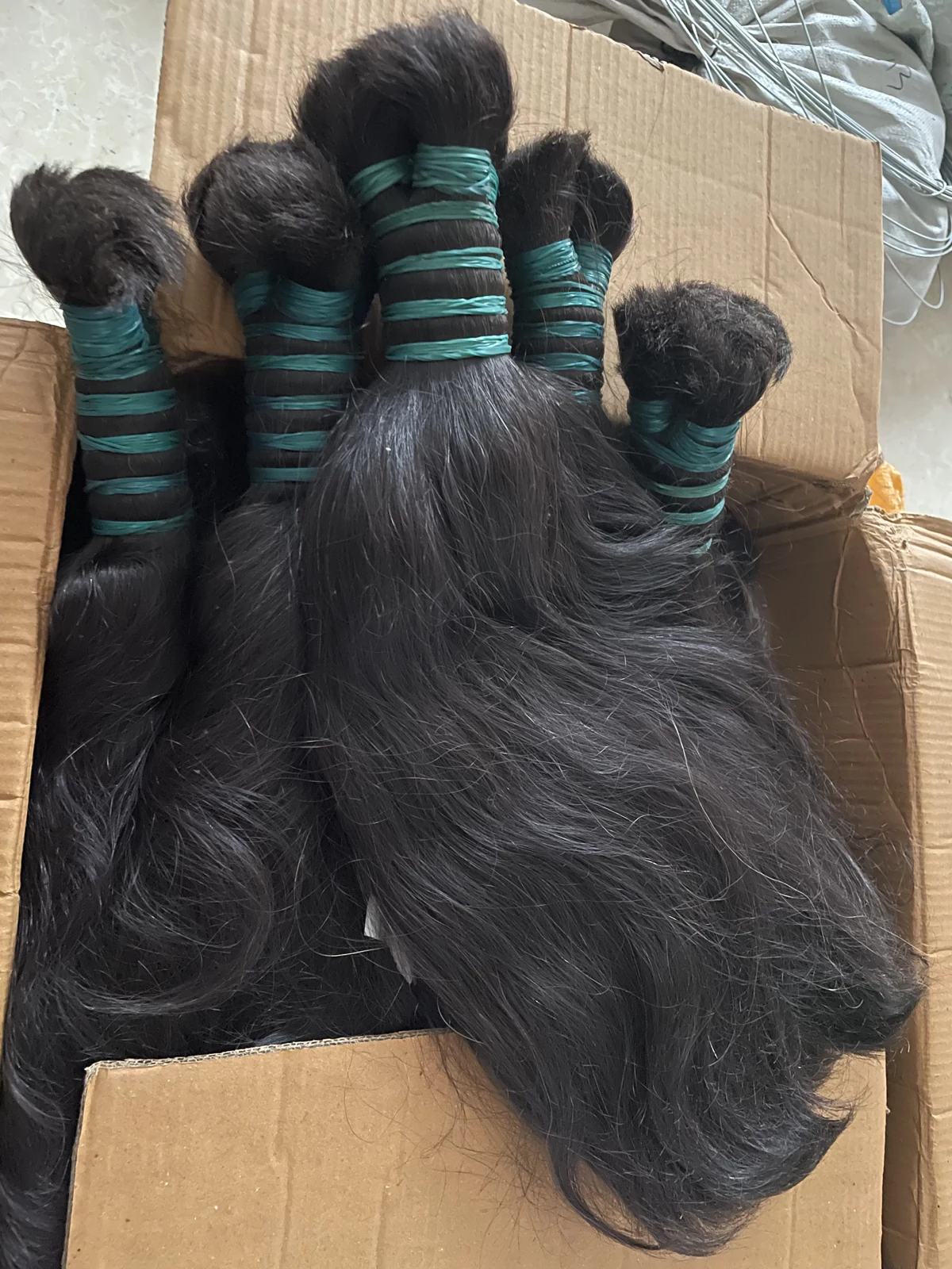 Raw human hair bundles prepared for selection